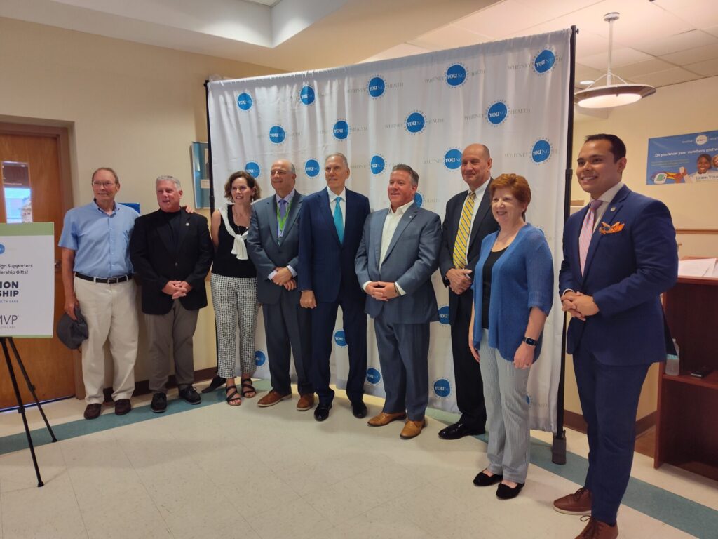 Officials stand together following the Opening Doors Capital Campaign Press Conference on July 22 to celebrate collaborative investments for Whitney Young Health. 